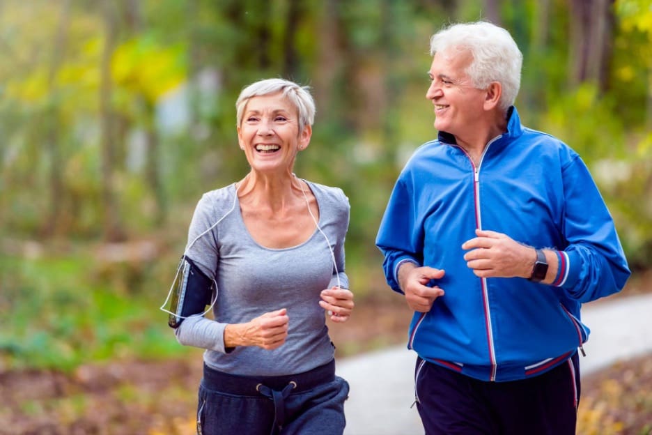 Couple jogging with iphone.