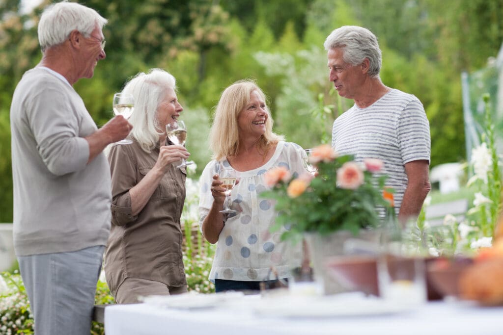 senior living couple invite friends to community to experience the lifestyle