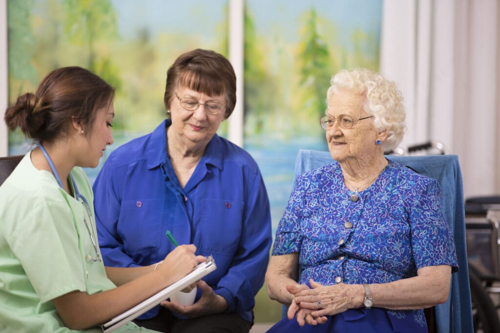 healthcare worker refers woman and her senior to a senior living community