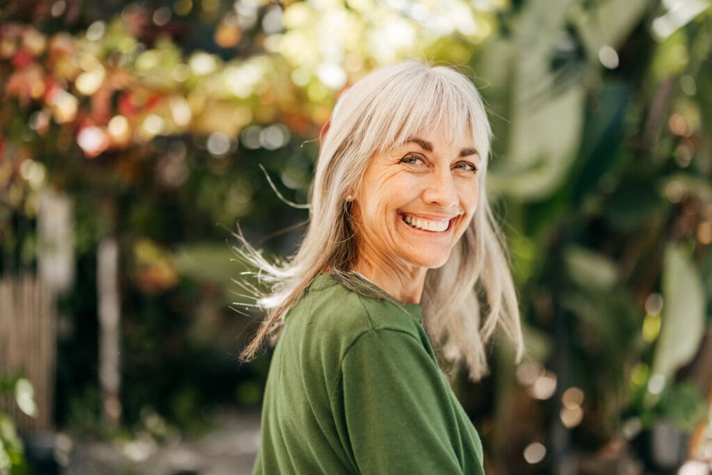 older woman smiles with confidence