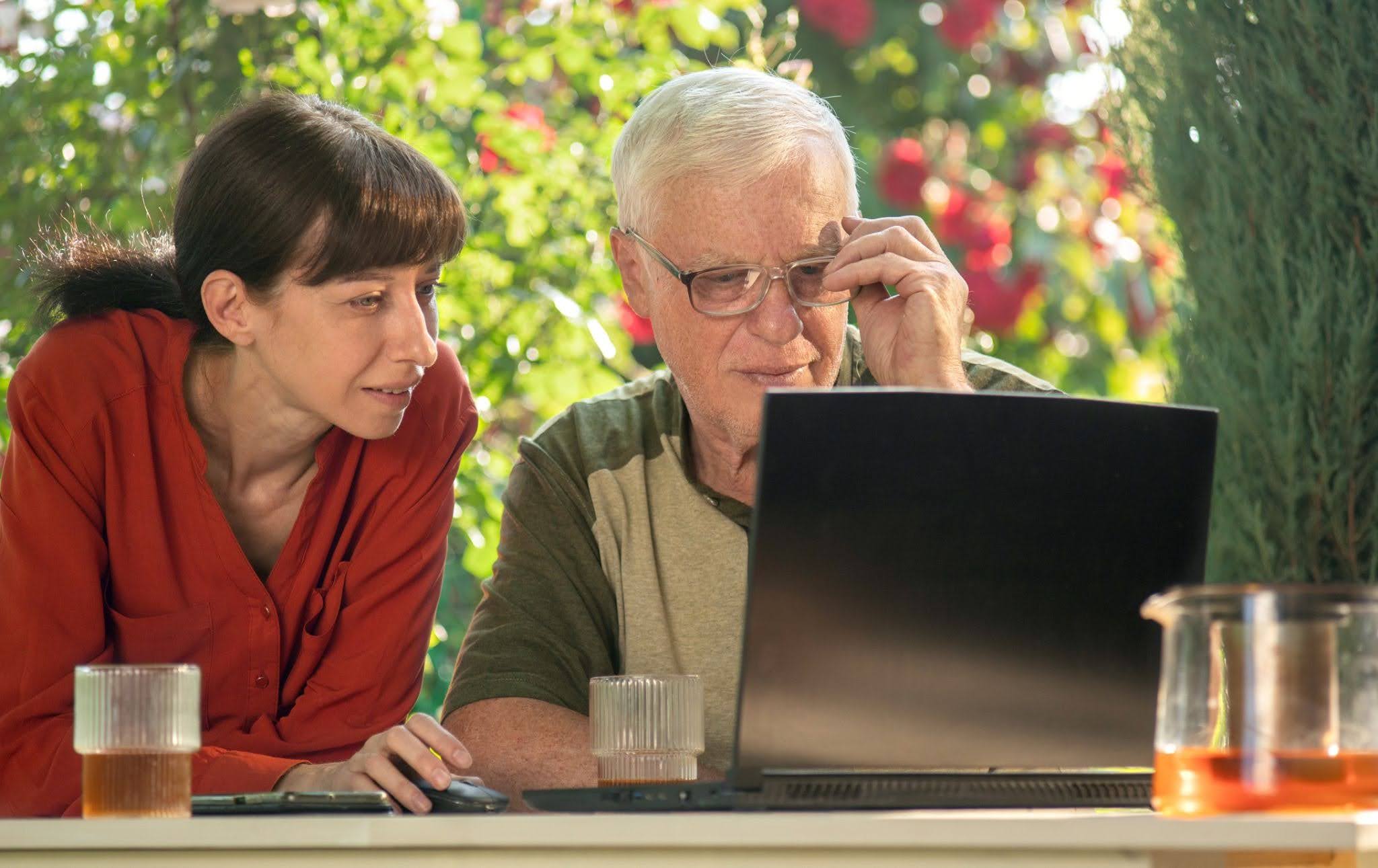 seniors looking at laptop