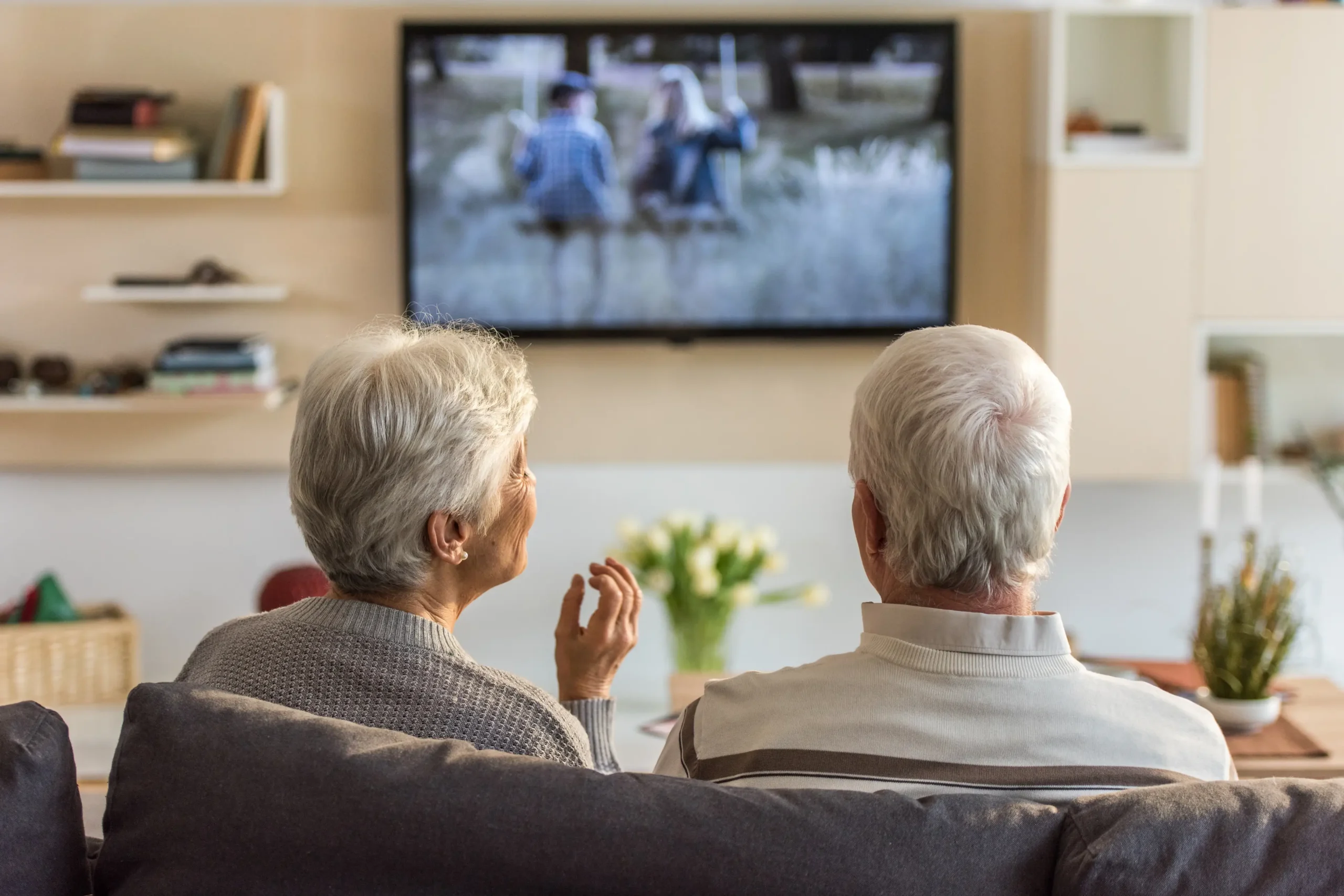Senior couple watching TV together